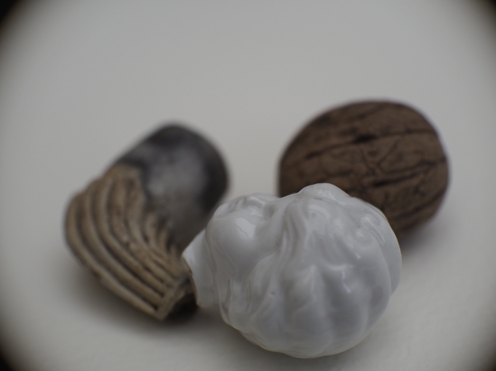 The sensations of Marguerite's lost body - clay pipes, a walnut, a feather, burnt umber